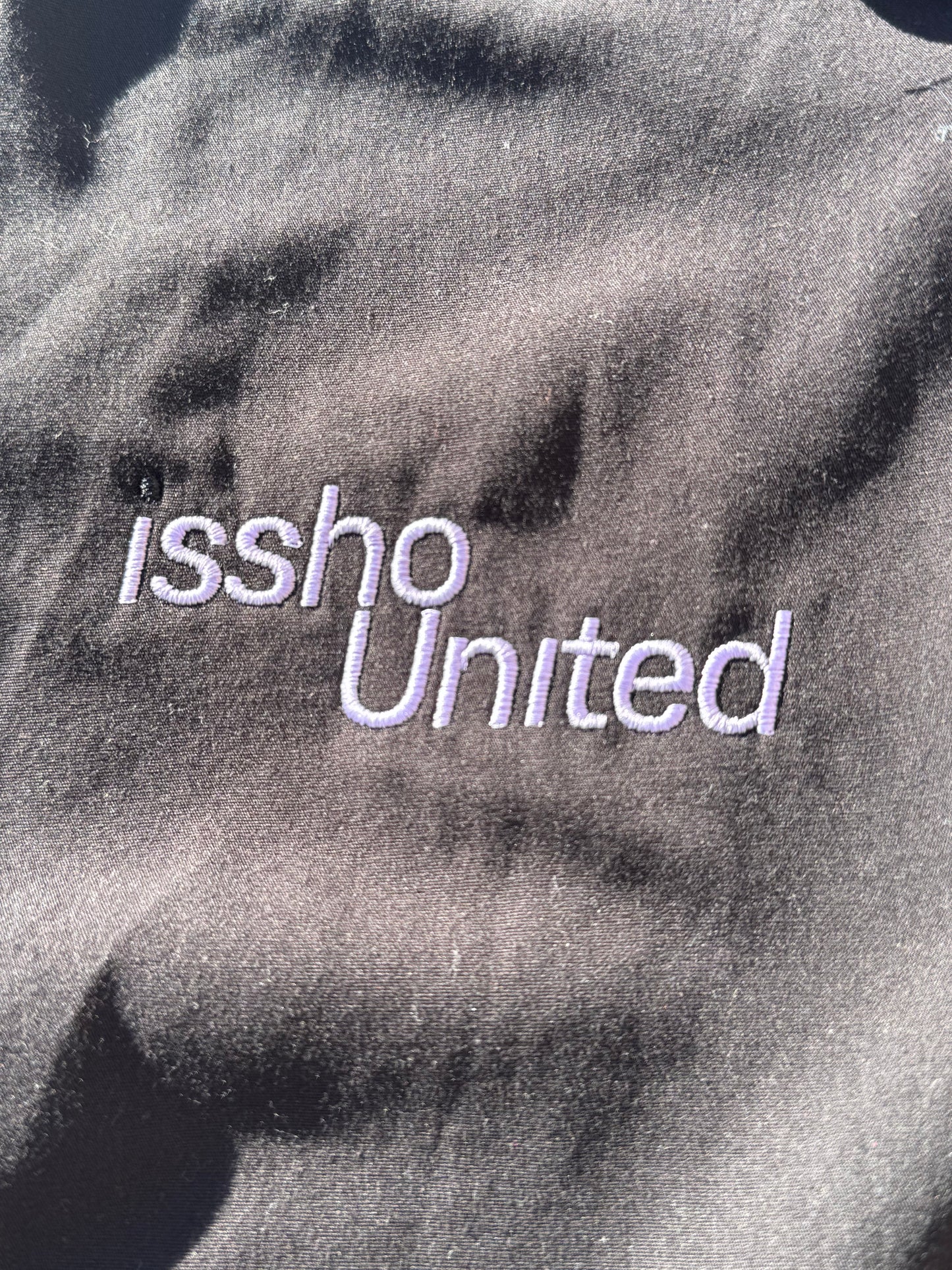 BLK: Upcycled 'issho United' logo shirts