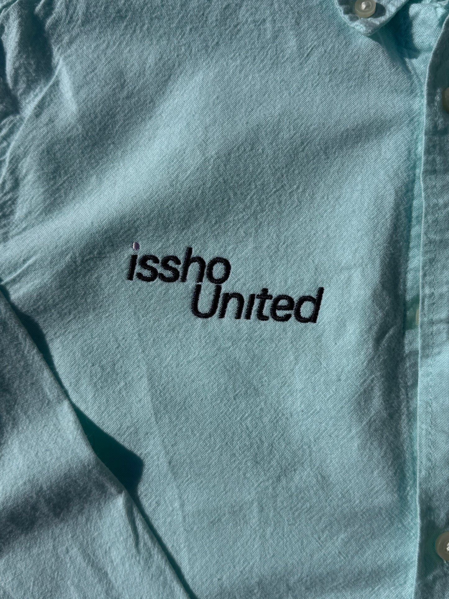 MINT: Upcycled 'issho United' logo shirts