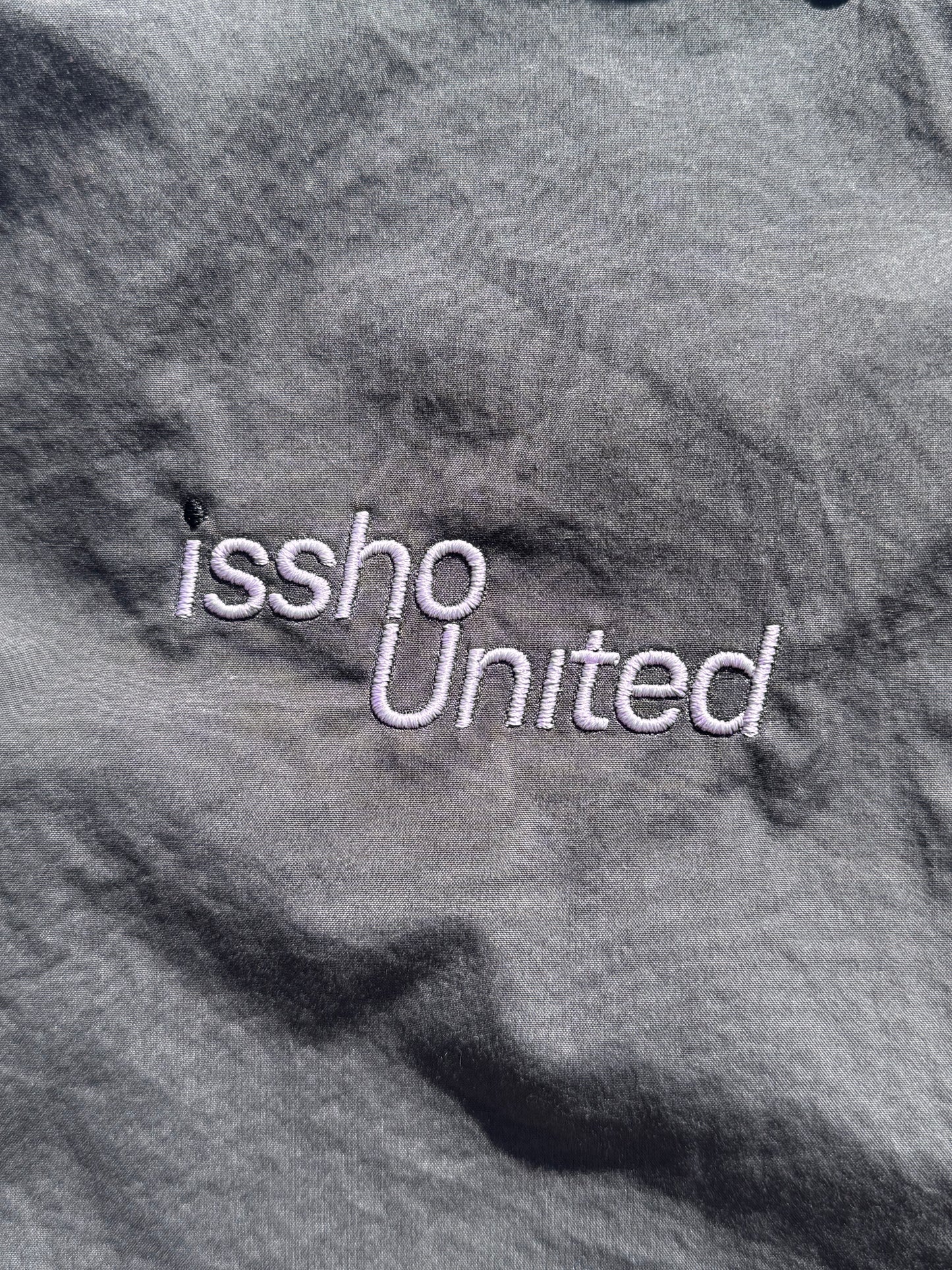PLAINGREY: Upcycled 'issho United' logo shirts