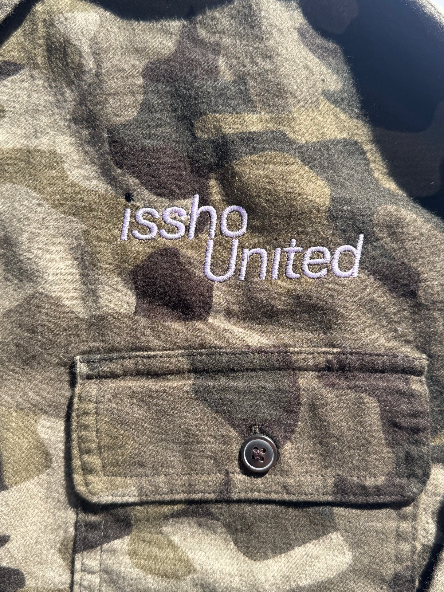 CAMO: Upcycled 'issho United' logo shirts
