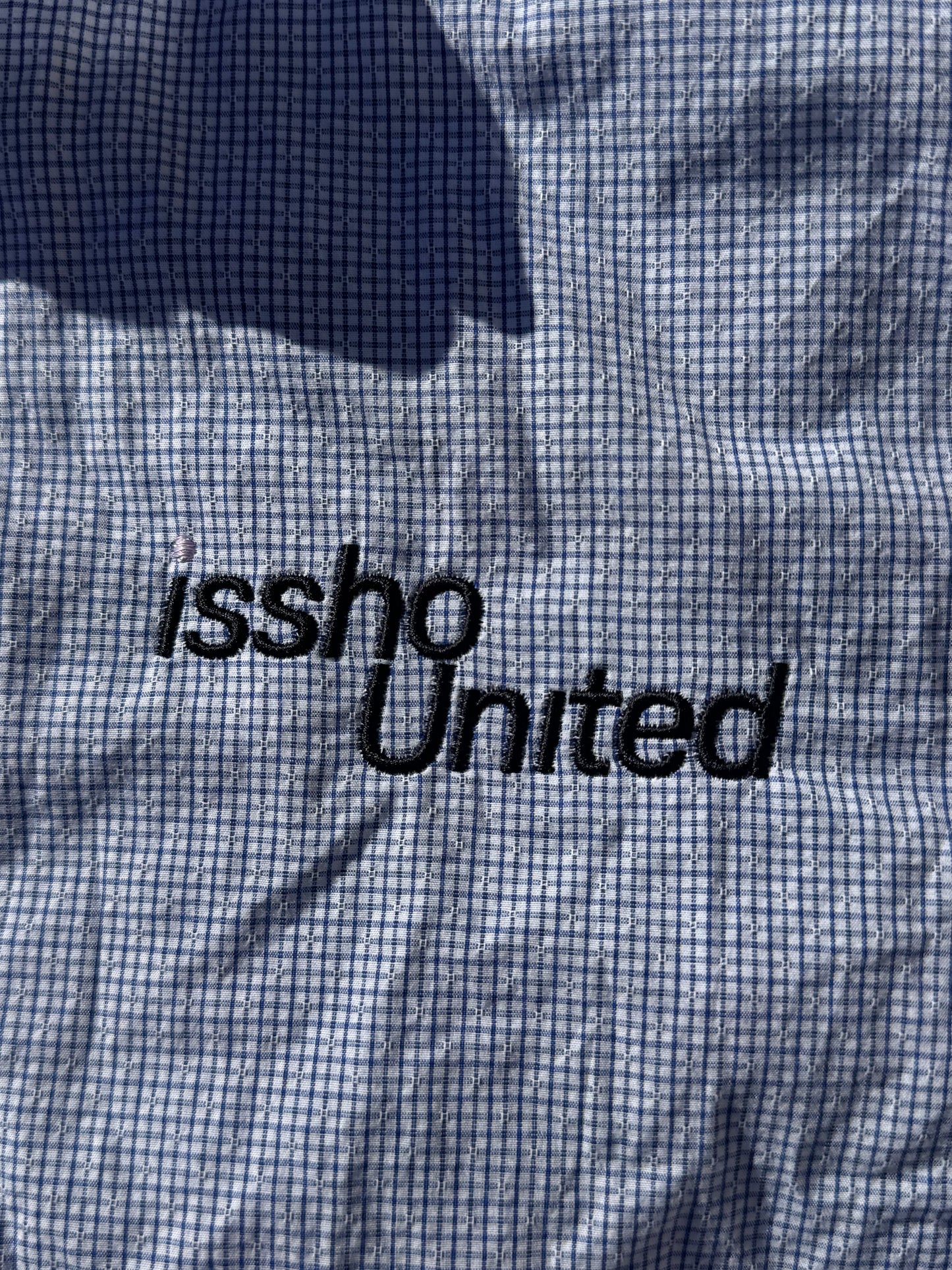 CHECKED: Upcycled 'issho United' logo shirts