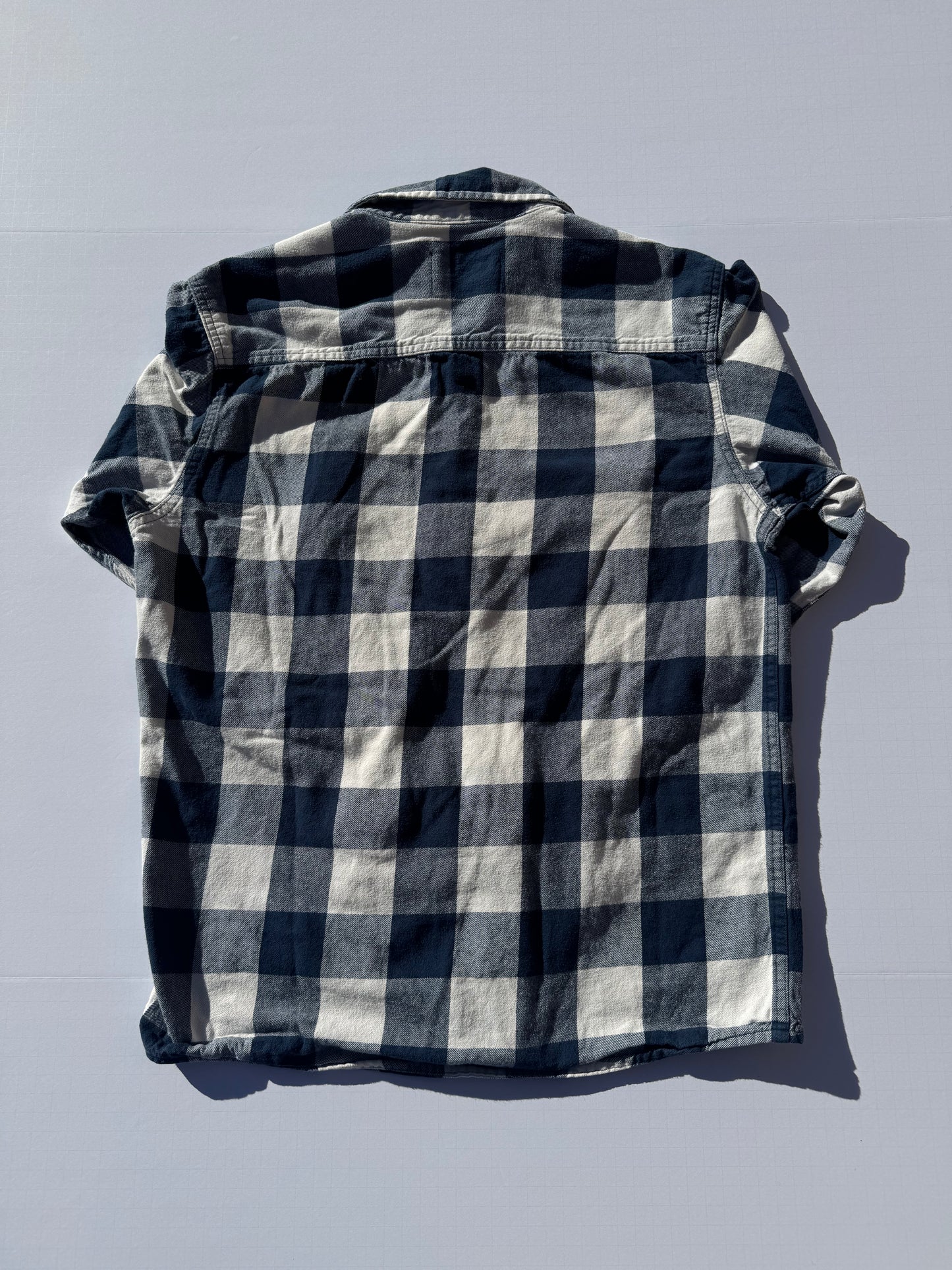 LUMBERJACK: Upcycled 'issho United' logo shirts