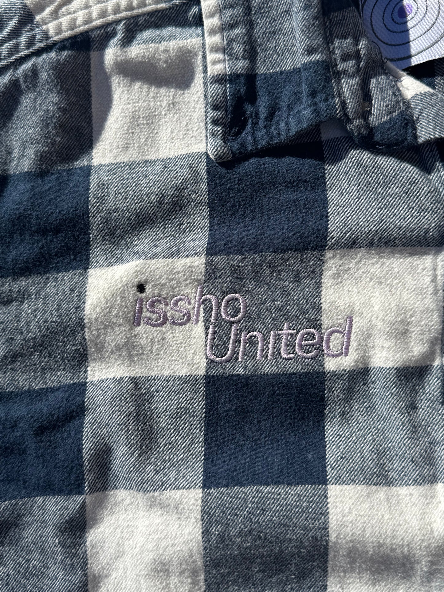 LUMBERJACK: Upcycled 'issho United' logo shirts