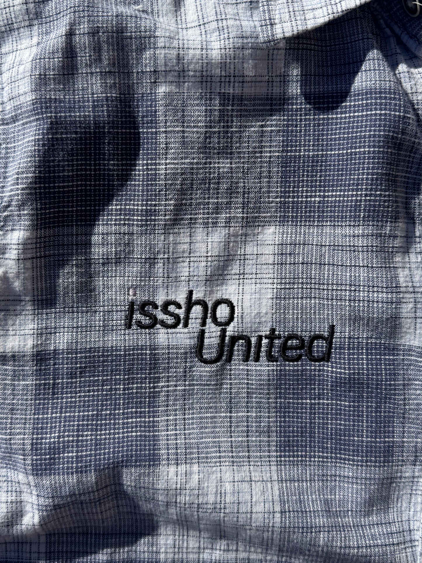 NAVY: Upcycled 'issho United' logo shirts