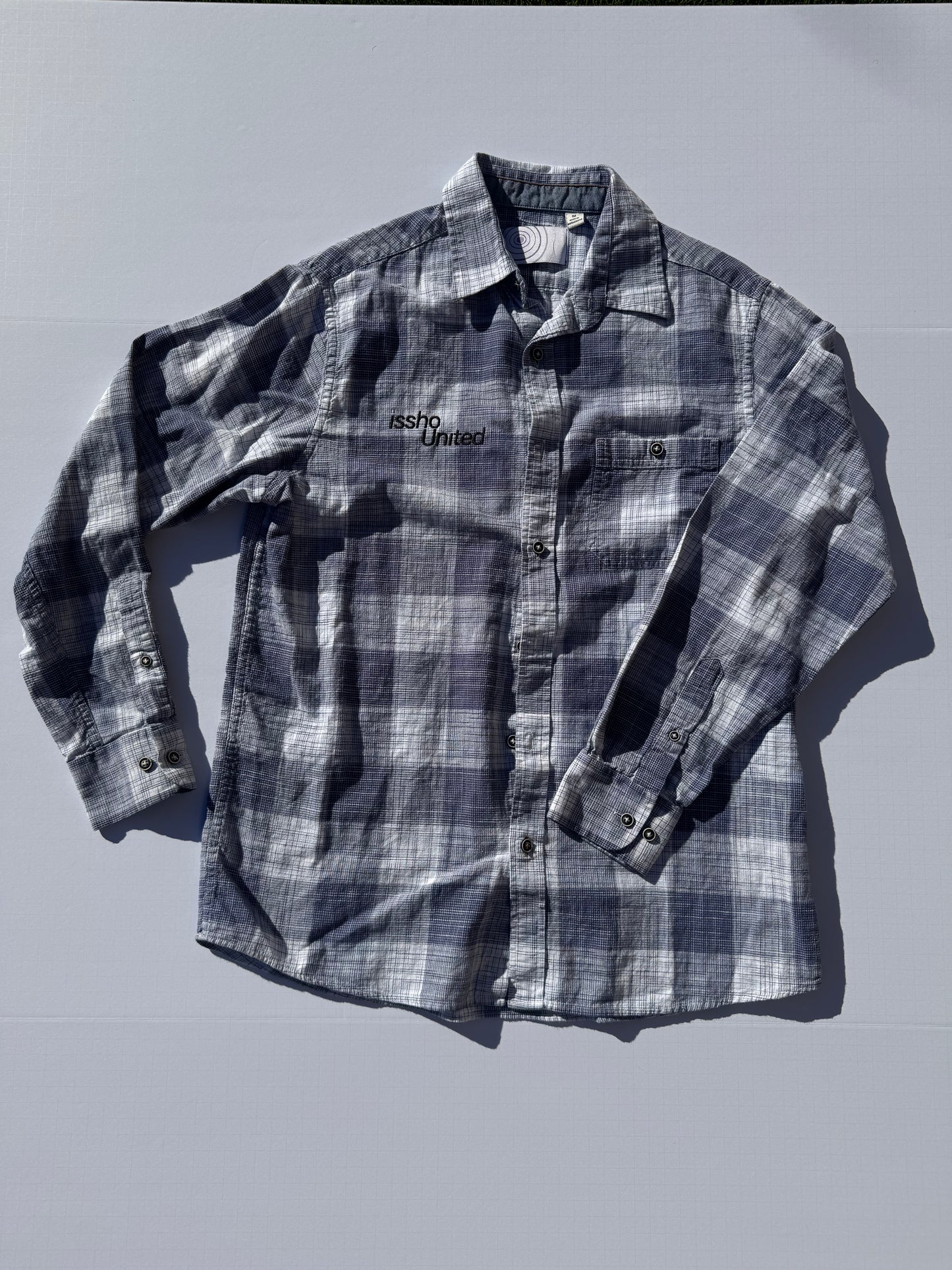 NAVY: Upcycled 'issho United' logo shirts