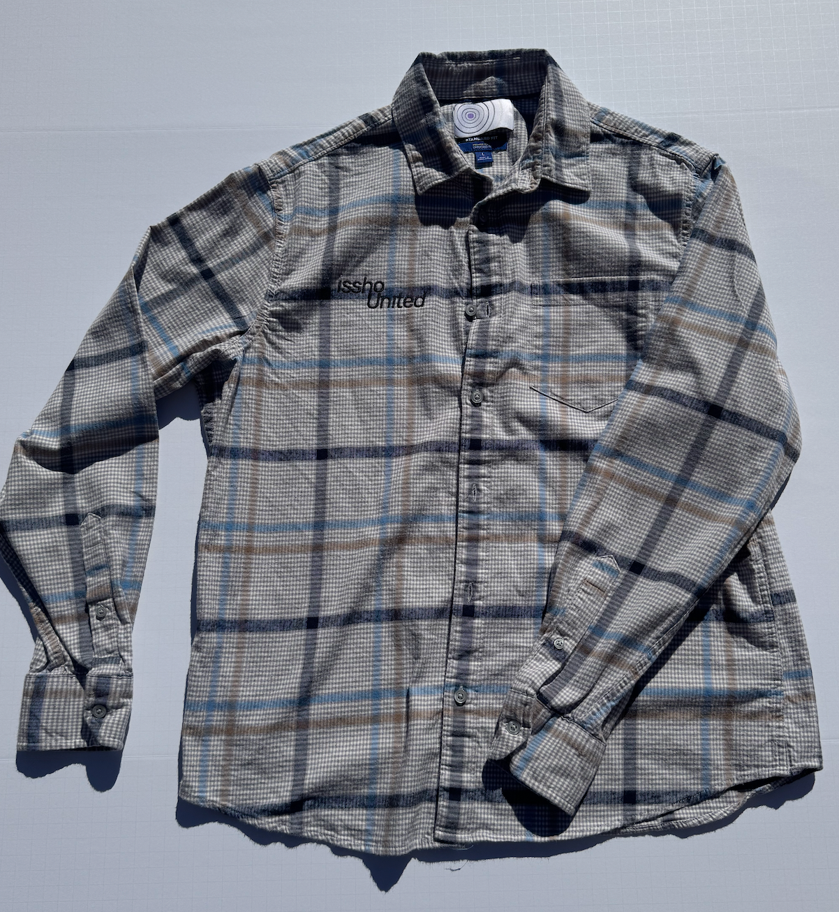 FLANNEL: Upcycled 'issho United' logo shirts