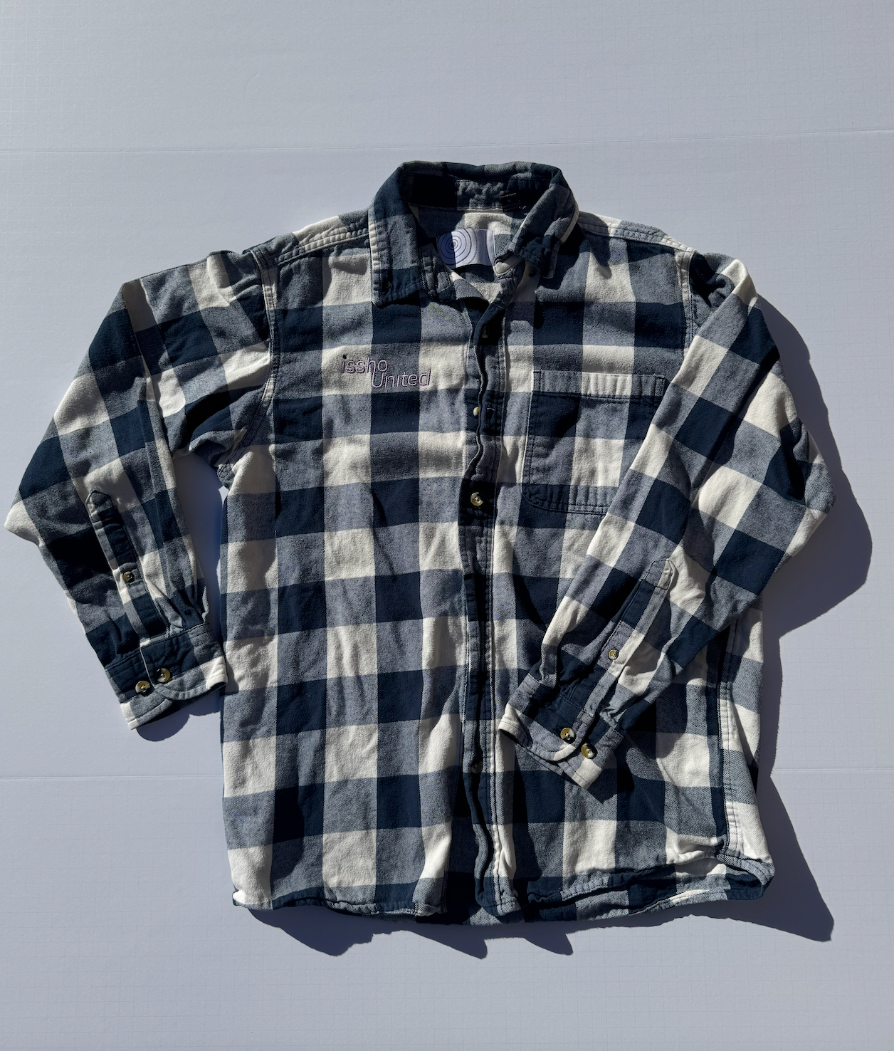 LUMBERJACK: Upcycled 'issho United' logo shirts