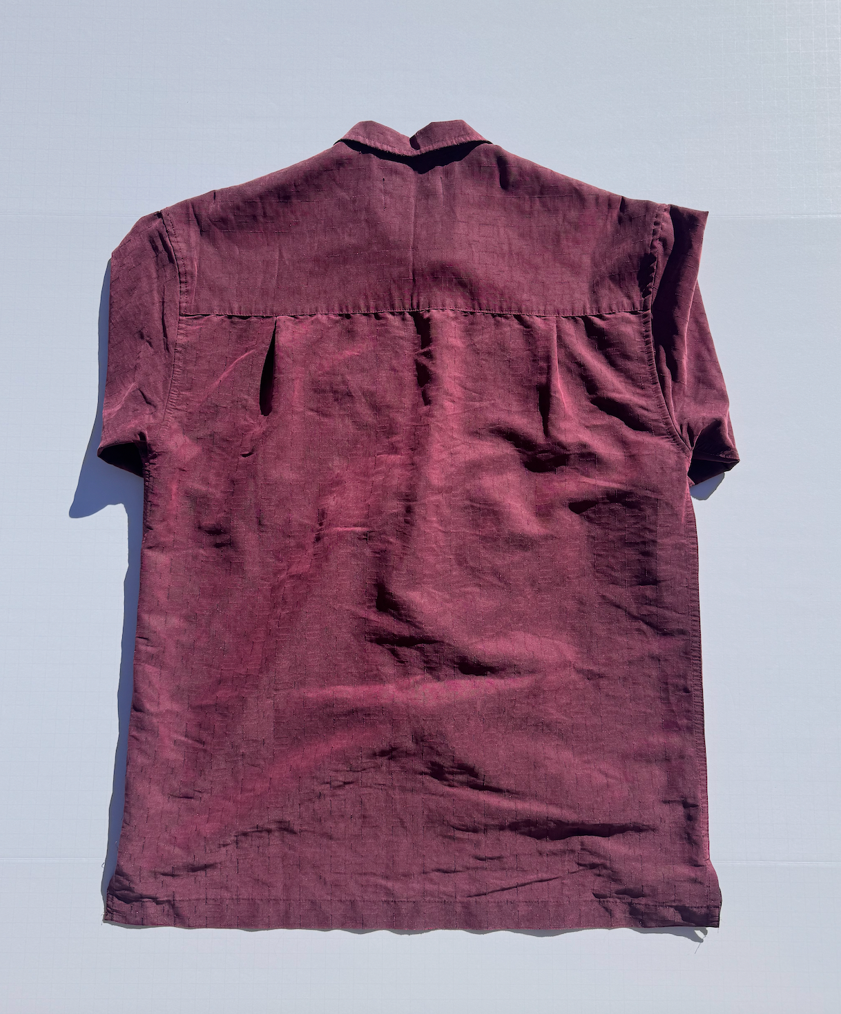 RED: Upcycled 'issho United' logo shirts