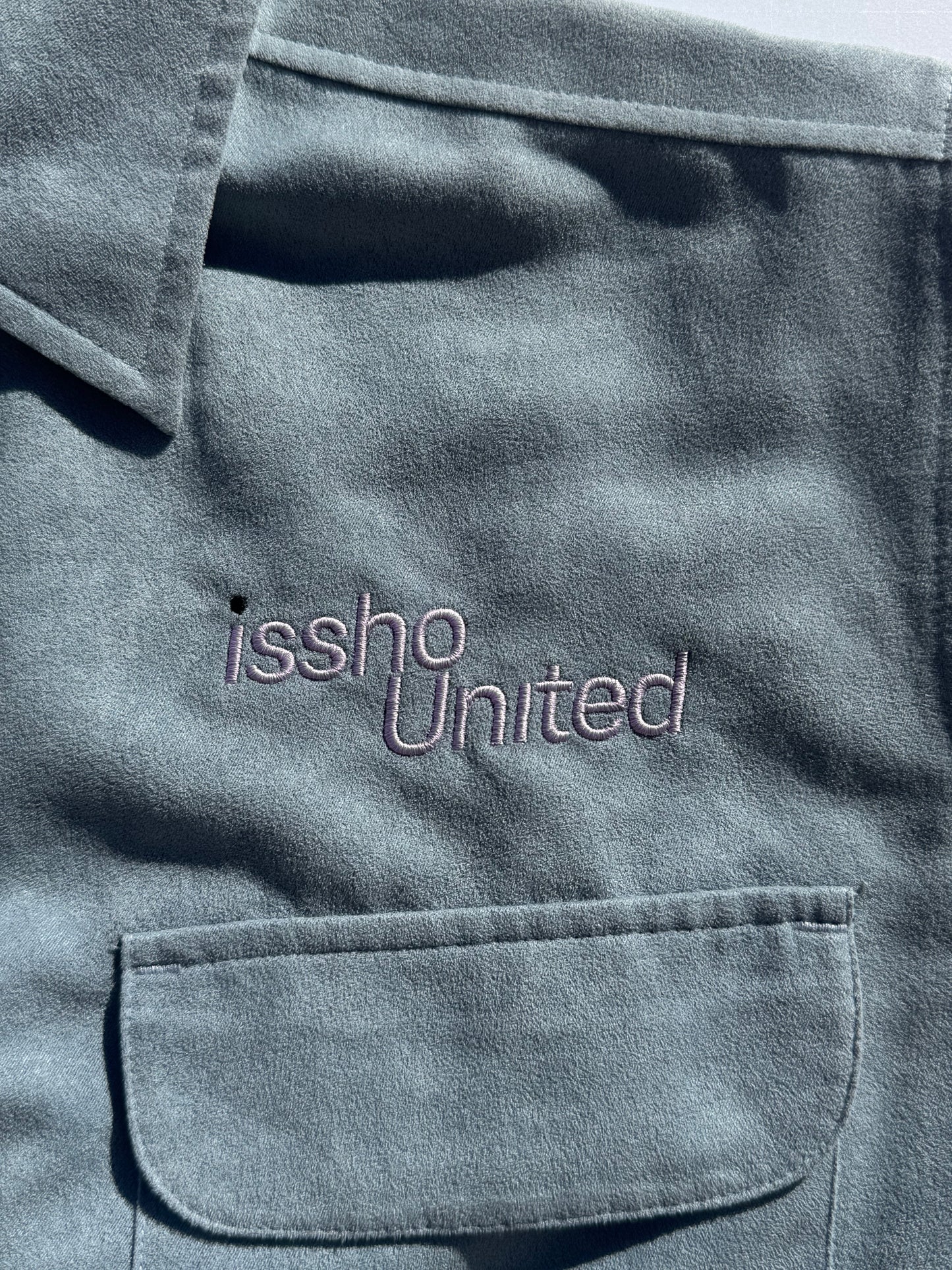 SUEDE: Upcycled 'issho United' logo shirts